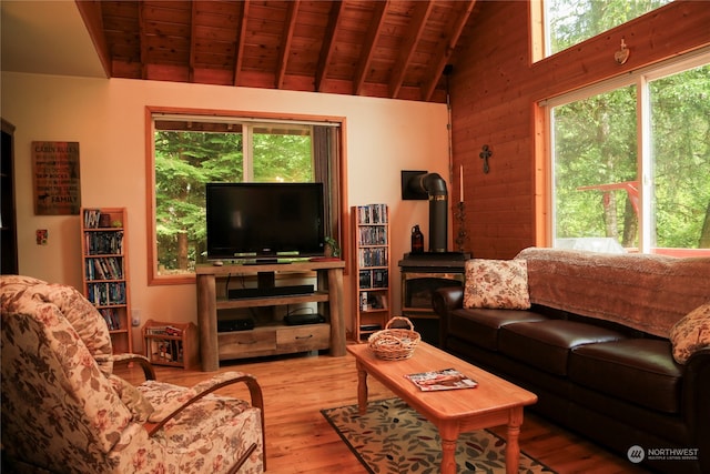 living room featuring wooden ceiling, plenty of natural light, and light hardwood / wood-style flooring