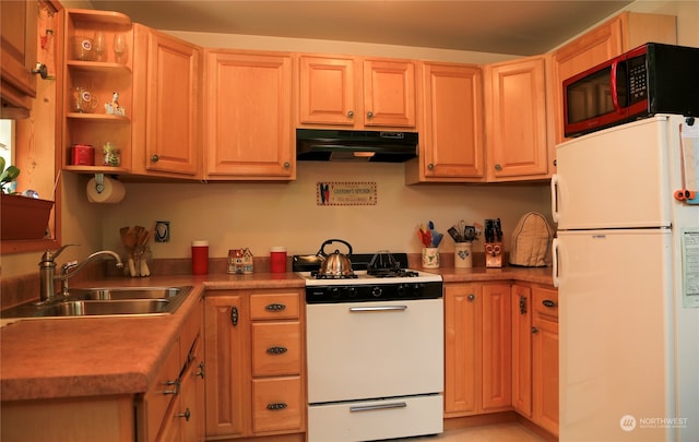 kitchen featuring white appliances, sink, and extractor fan