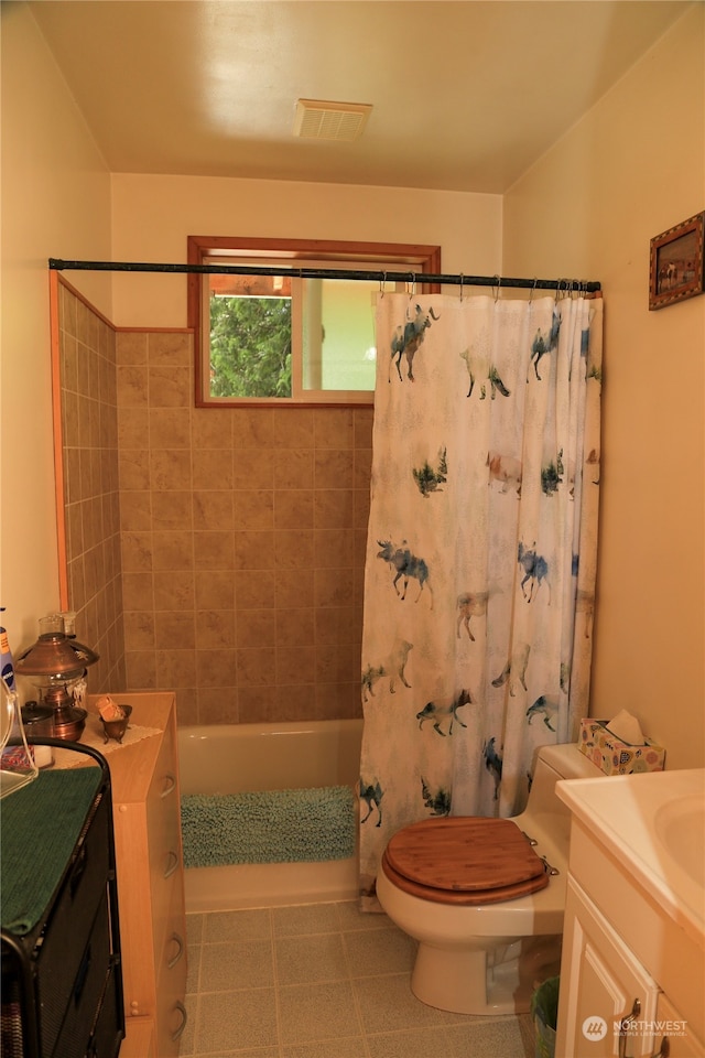 full bathroom featuring tile floors, toilet, shower / bath combo, and vanity