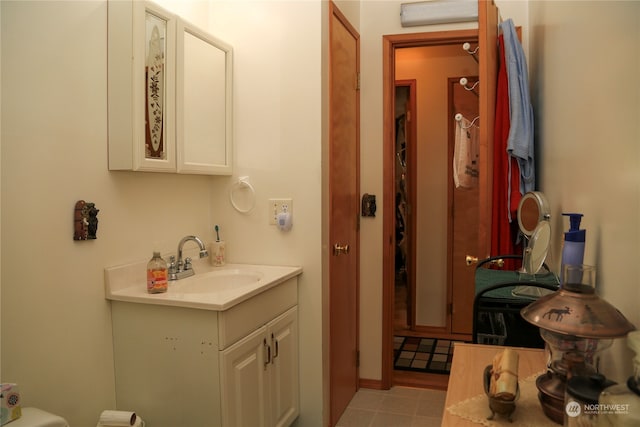 bathroom featuring tile flooring and large vanity