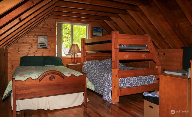 bedroom with lofted ceiling, wood walls, hardwood / wood-style flooring, and wood ceiling