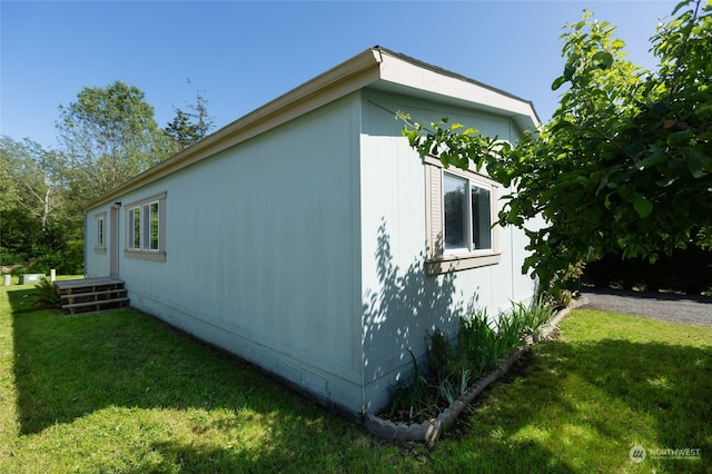 view of home's exterior with a lawn