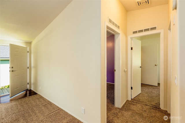 corridor with visible vents and carpet