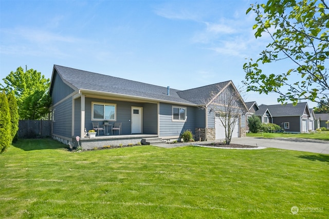 view of front of property with a garage and a front yard