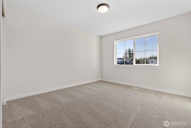 spare room featuring carpet flooring