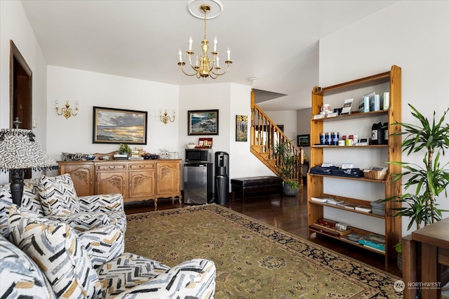 living room with a chandelier and dark hardwood / wood-style floors