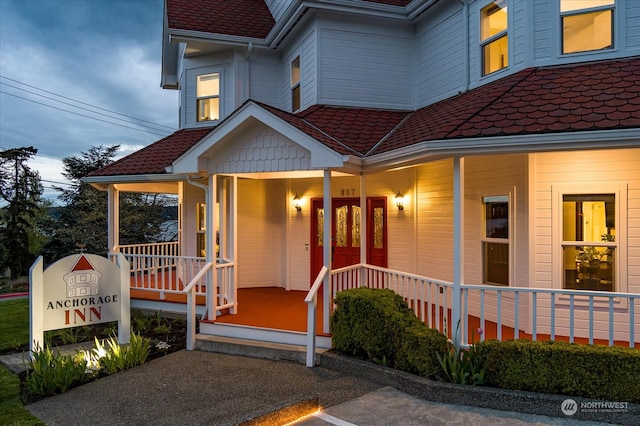 doorway to property with a porch