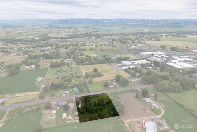 drone / aerial view with a water and mountain view