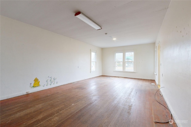 spare room featuring hardwood / wood-style floors