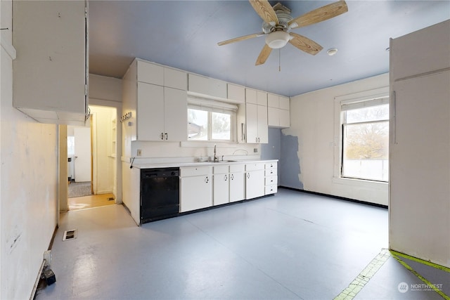 kitchen featuring white cabinetry, sink, black dishwasher, and ceiling fan