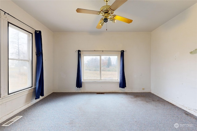 carpeted empty room with ceiling fan