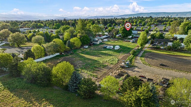 drone / aerial view featuring a mountain view