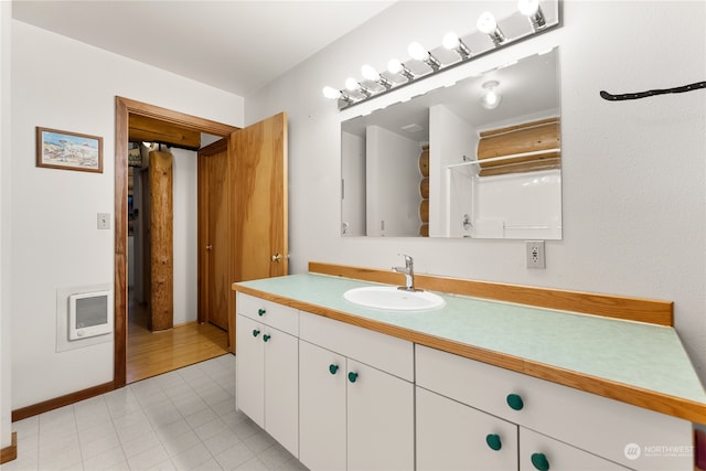 bathroom with oversized vanity and tile floors