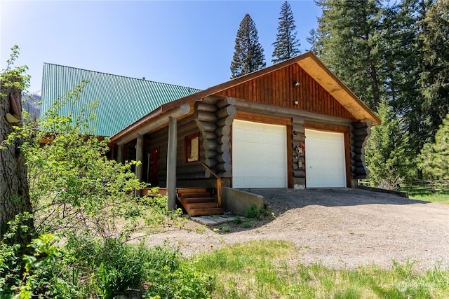 view of front of home featuring an outdoor structure and a garage