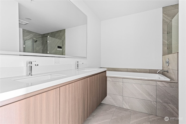 bathroom with separate shower and tub, tile patterned flooring, and vanity