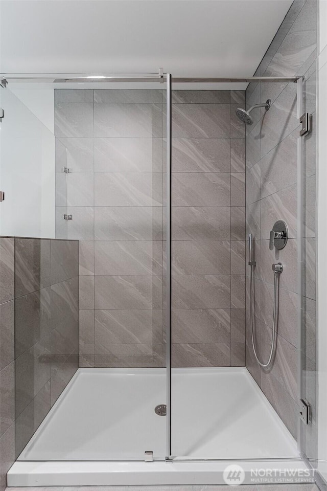 bathroom featuring a shower stall