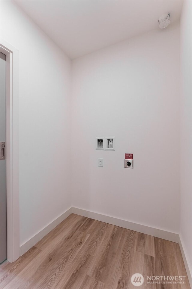 washroom featuring washer hookup, light wood-style floors, hookup for an electric dryer, laundry area, and baseboards