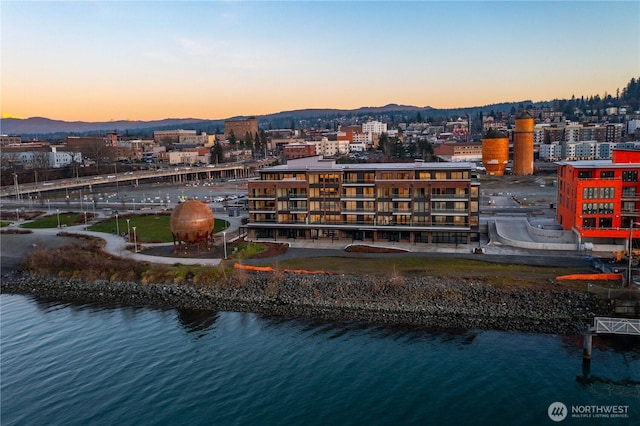 birds eye view of property featuring a water and mountain view