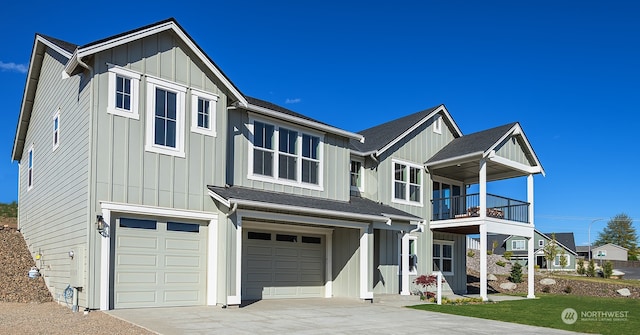 view of front of property with a garage and a balcony