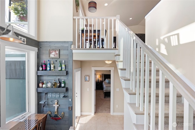 stairs with light tile floors