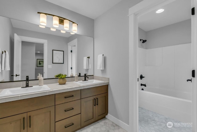 bathroom featuring vanity and washtub / shower combination