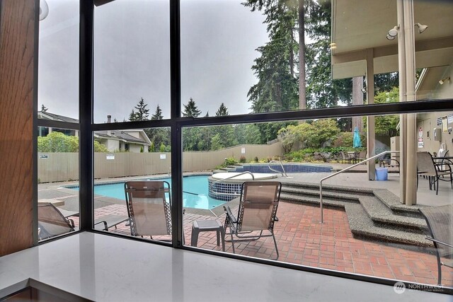 view of pool featuring a patio