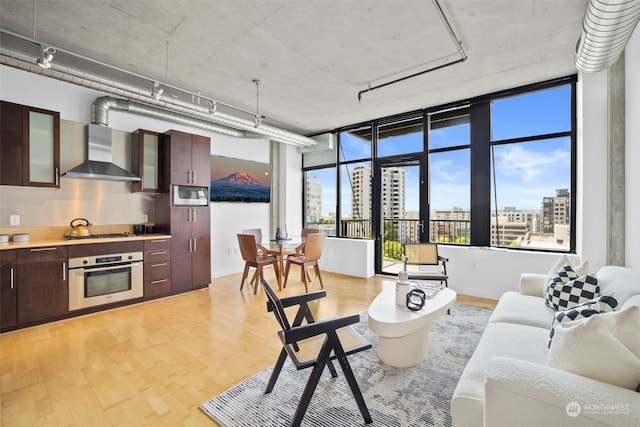 living area with a city view and light wood-style flooring