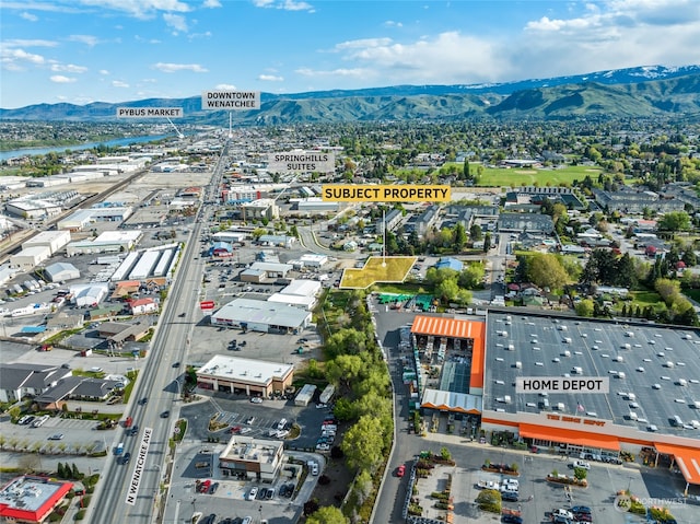 birds eye view of property with a mountain view