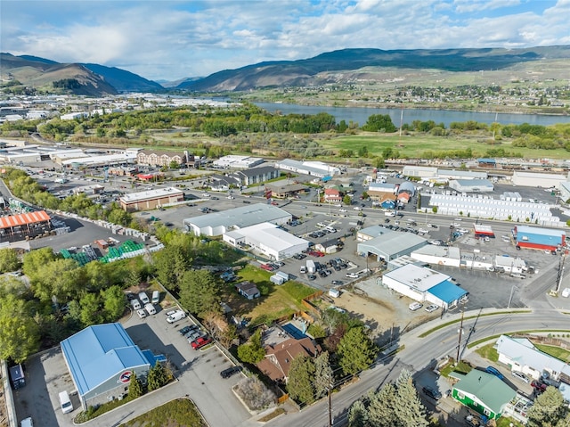 bird's eye view with a water and mountain view