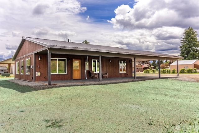 ranch-style home featuring a patio and a front lawn