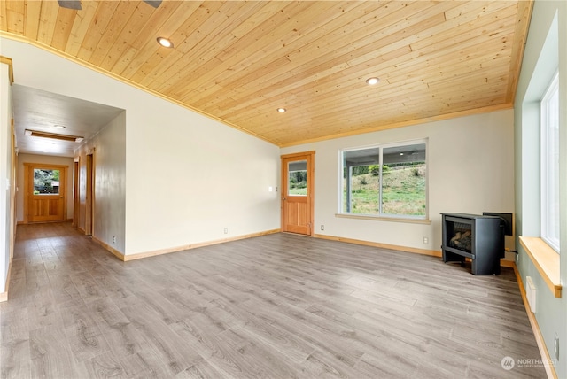 unfurnished living room featuring crown molding, hardwood / wood-style floors, wood ceiling, and a wood stove