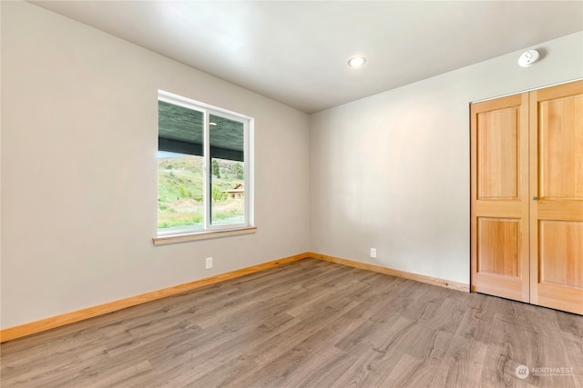 unfurnished bedroom with light hardwood / wood-style flooring