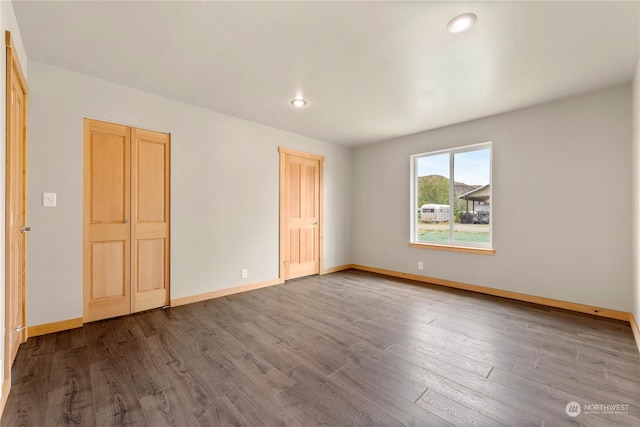 empty room featuring hardwood / wood-style flooring