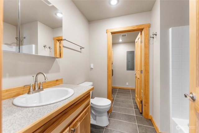 bathroom featuring tile floors, toilet, and oversized vanity