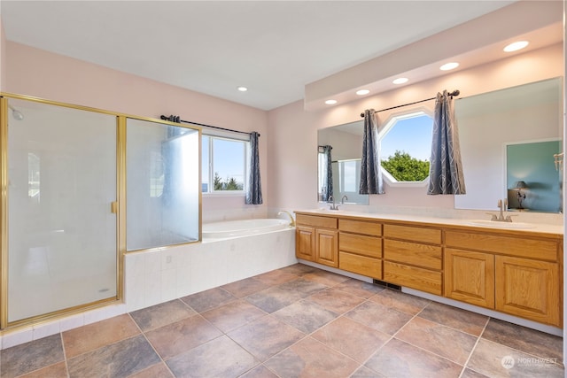 bathroom with vanity, plenty of natural light, and plus walk in shower