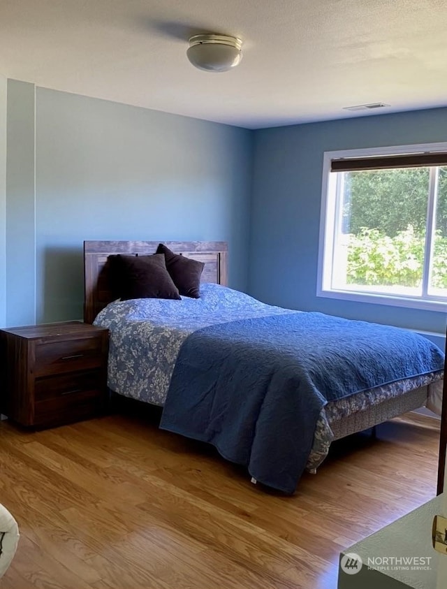 bedroom featuring hardwood / wood-style flooring