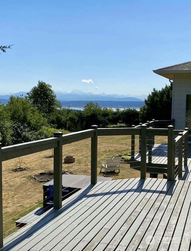 wooden deck with a mountain view