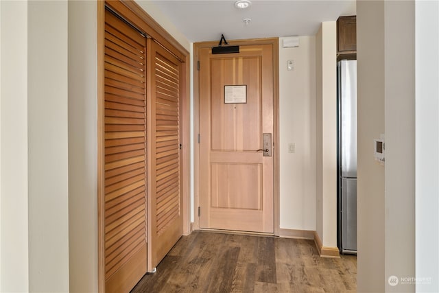 corridor with dark wood-type flooring