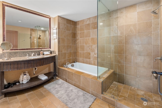 bathroom featuring tile floors, tile walls, separate shower and tub, and vanity