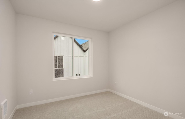 unfurnished room with carpet flooring