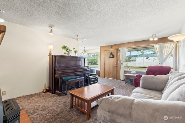 513 Cleveland Ave, South Cle Elum, WA 98943 - carpeted living room with an inviting chandelier and a textured ceiling
