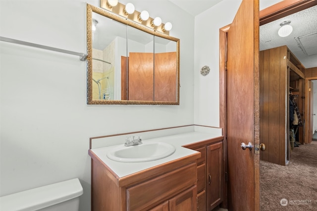 513 Cleveland Ave, South Cle Elum, WA 98943 - bathroom with a textured ceiling, vanity, and toilet