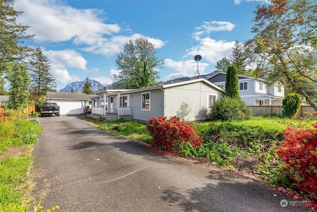 view of front of home featuring a garage and a mountain view