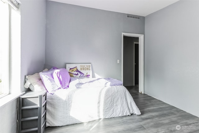 bedroom featuring hardwood / wood-style flooring