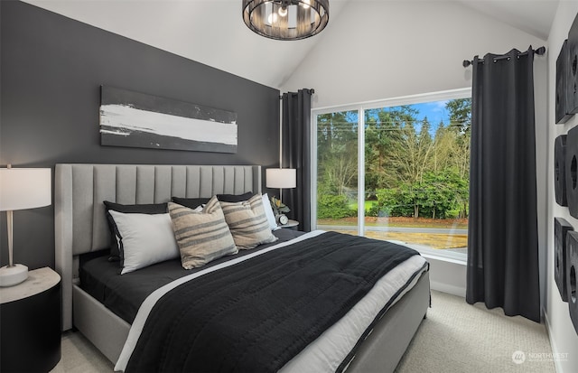 carpeted bedroom with lofted ceiling