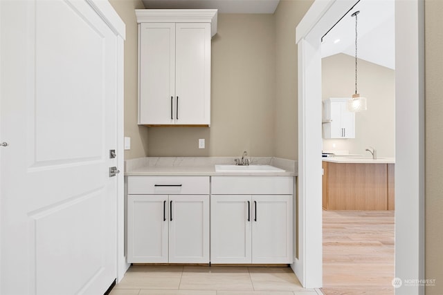 interior space featuring sink and light wood-type flooring