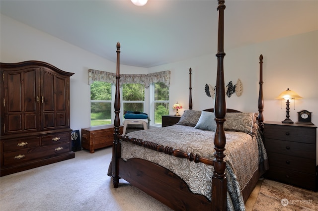 carpeted bedroom featuring vaulted ceiling