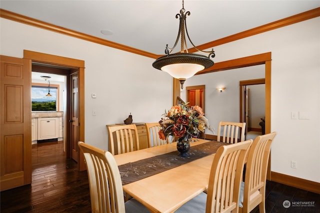 dining space featuring dark hardwood / wood-style floors and crown molding