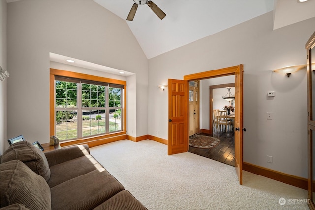 living room with high vaulted ceiling, carpet flooring, and ceiling fan