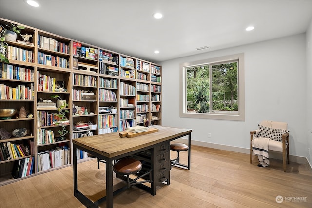 office space with light hardwood / wood-style flooring